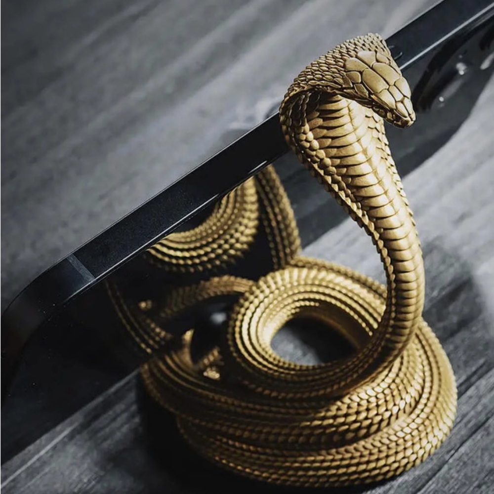 Coppertist.Wu cobra phone stand in brass.